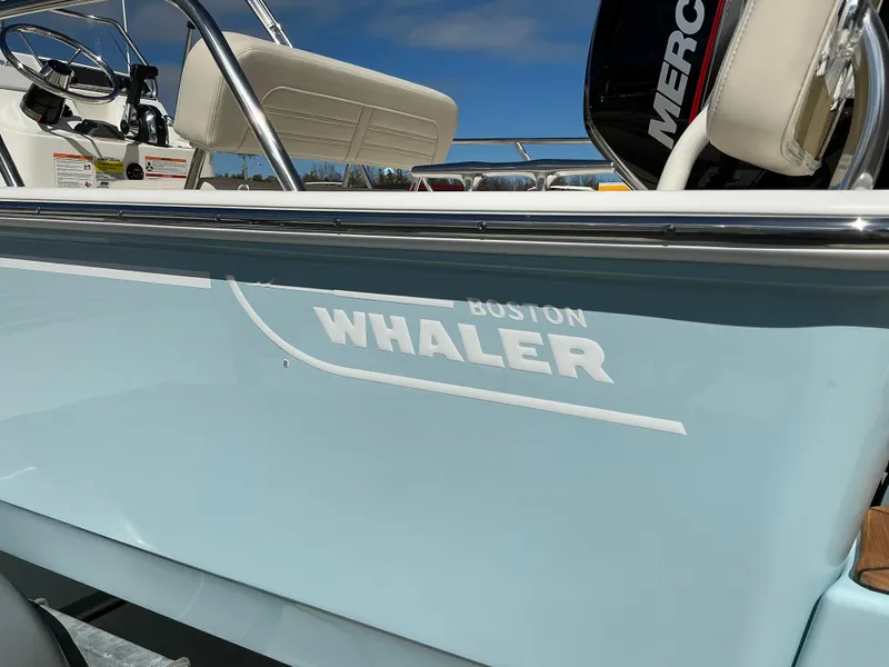Slide: The Image of 2025 Boston Whaler 170 Montauk boat, side view with logo and seating. - 8