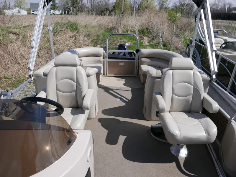 Slide: The Image of 2012 Sylvan Mirage 8522 LZ pontoon boat with beige seating and open deck layout. - 10