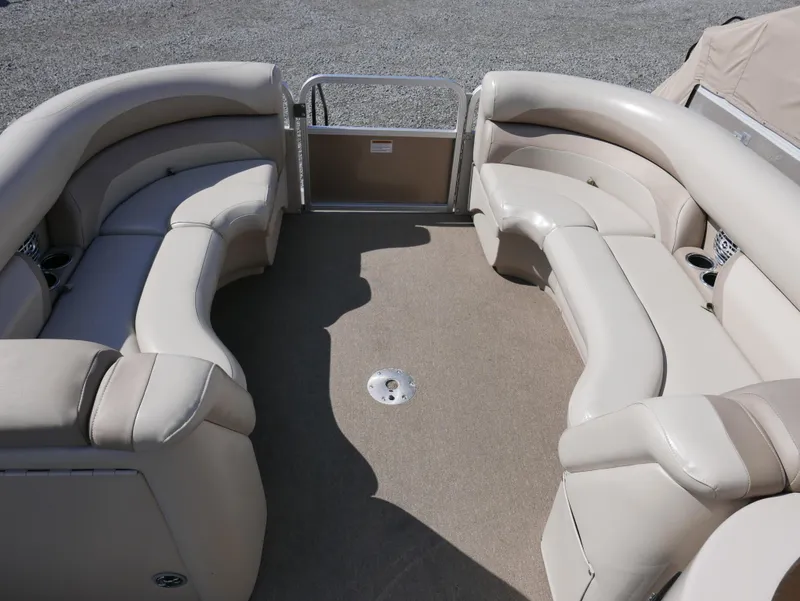 Slide: The Image of 2012 Sylvan Mirage 8522 LZ pontoon boat with beige seating and spacious deck. - 7