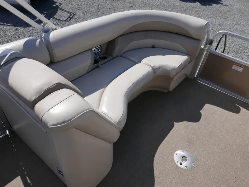 Slide: The Image of 2012 Sylvan Mirage 8522 LZ boat interior with beige seating and carpeted floor. - 9