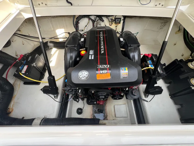 Slide: The Image of 2014 Chaparral 257 SSX engine compartment with Volvo Penta 320 V8 engine. - 11