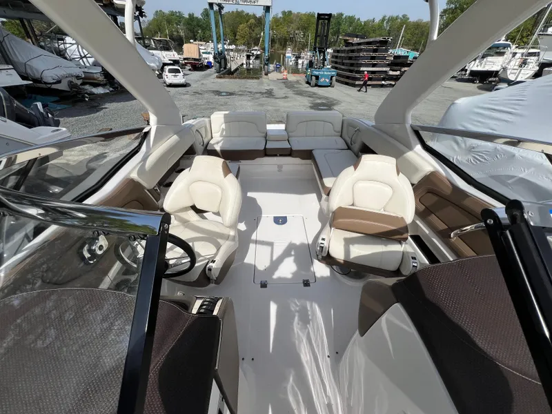 Slide: The Image of 2014 Chaparral 257 SSX boat interior with luxurious seating and modern design. - 3