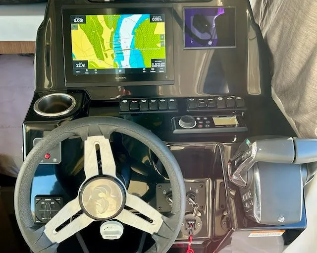 Slide: The Image of 2024 Beneteau Antares 9 helm with navigation display and controls. - 10