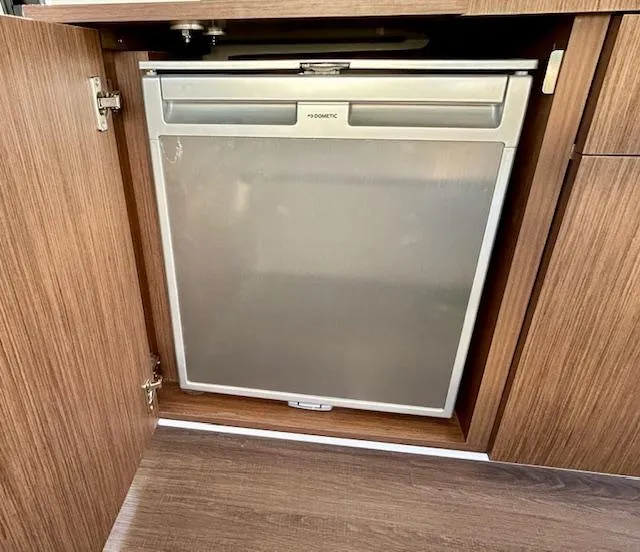 Slide: The Image of Built-in Dometic fridge in 2024 Beneteau Antares 9 boat kitchen cabinet. - 15
