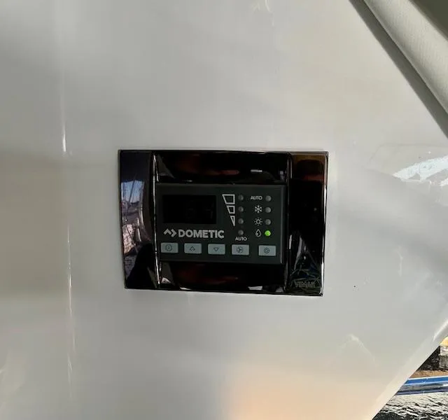 Slide: The Image of Dometic control panel on 2024 Beneteau Antares 9 boat interior. - 18