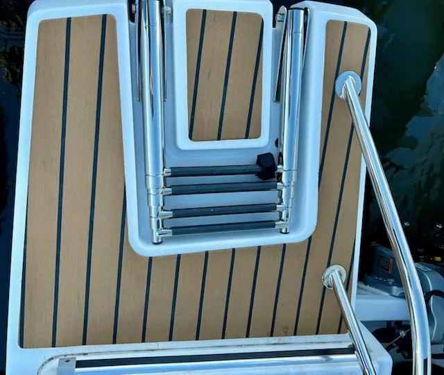 Slide: The Image of 2024 Beneteau Antares 9 swim platform with foldable ladder and teak decking. - 7