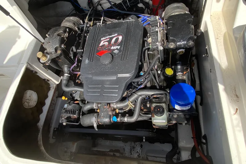 Slide: The Image of 2006 Sea Ray 220 Sundeck engine compartment with 5.0 MPI motor. - 14
