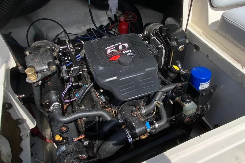 Slide: The Image of Engine compartment of a 2006 Sea Ray 220 Sundeck boat. - 16