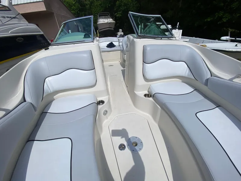Slide: The Image of 2006 Sea Ray 220 Sundeck interior with white seating and open deck layout. - 5