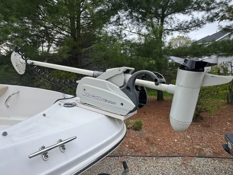 Slide: The Image of 2013 Chaparral 19 Sport H2O with MotorGuide wireless trolling motor, parked outdoors. - 7