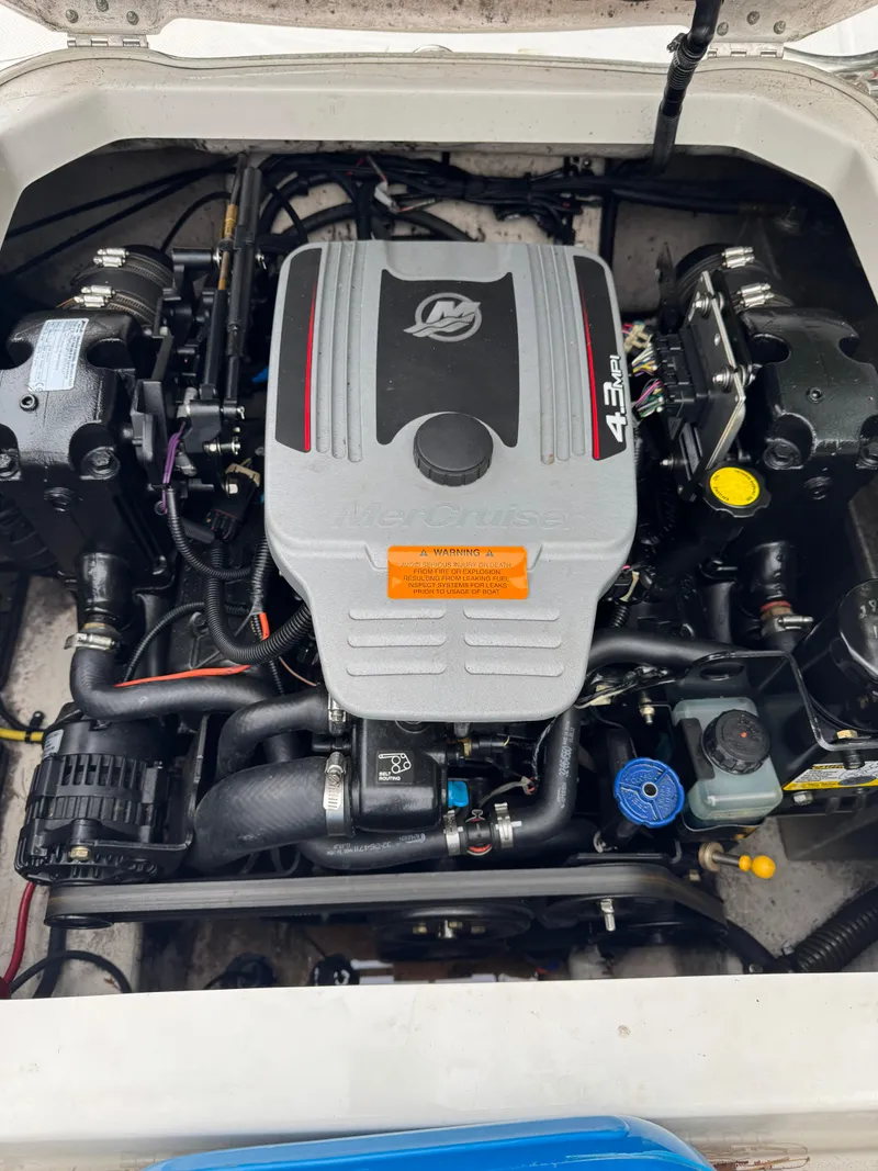 Slide: The Image of Engine compartment of a 2013 Chaparral 19 Sport H2O boat, featuring a MerCruiser 4.3L engine. - 8