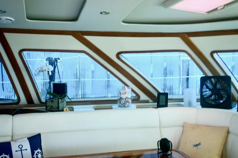 Slide: The Image of Interior of 2009 Prout 45S yacht with large windows and comfortable seating. - 10