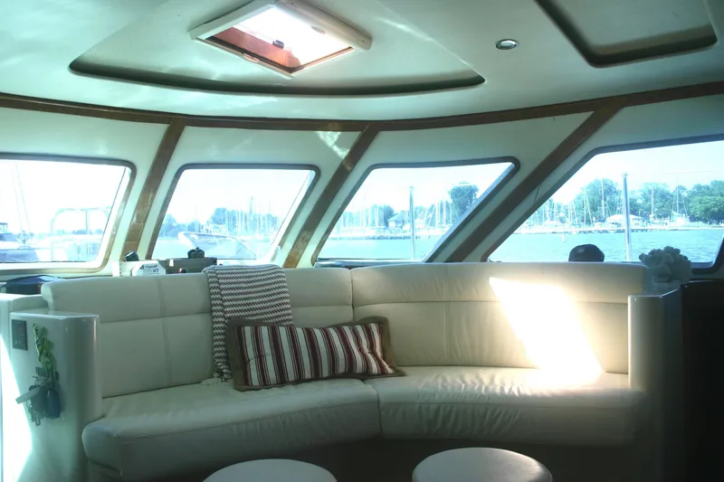Slide: The Image of Luxurious interior of 2009 Prout 45S yacht with panoramic windows and plush seating. - 13