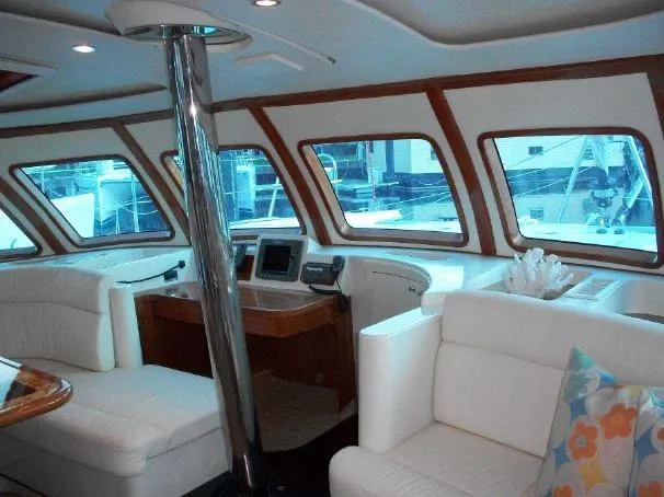 Slide: The Image of Luxurious interior of 2009 Prout 45S yacht with white seating and large windows. - 15