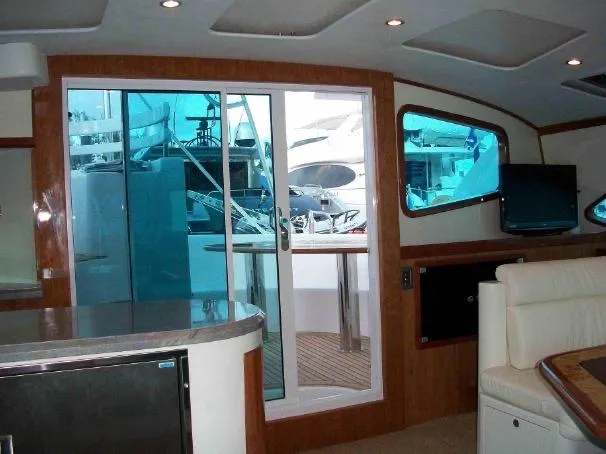 Slide: The Image of Interior of 2009 Prout 45S yacht with modern furnishings and sliding glass door. - 17