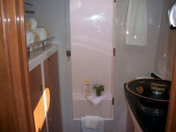 Slide: The Image of Luxurious bathroom in 2009 Prout 45S yacht with modern fixtures and elegant decor. - 20