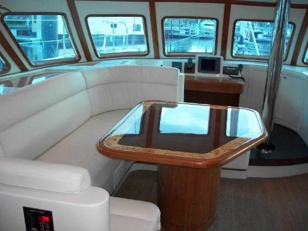 Slide: The Image of Luxurious interior of a 2009 Prout 45S yacht with elegant seating and polished table. - 25