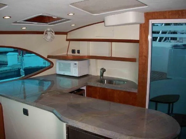 Slide: The Image of Interior of 2009 Prout 45S yacht with modern kitchen and sleek countertops. - 31