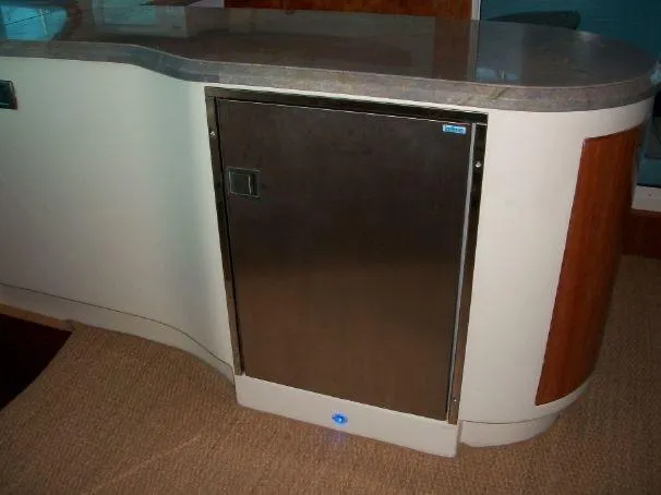 Slide: The Image of Modern kitchen area in a 2009 Prout 45S yacht, featuring sleek cabinetry and countertop. - 32