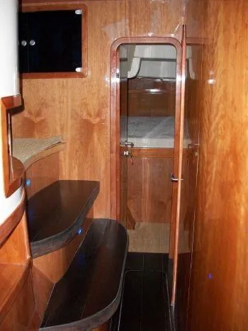 Slide: The Image of Interior of 2009 Prout 45S yacht with wooden finishes and cabin view. - 35