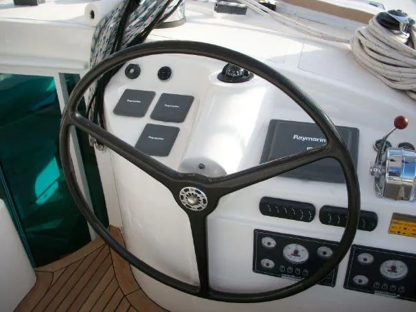Slide: The Image of Steering wheel and controls of a 2009 Prout 45S yacht. - 38