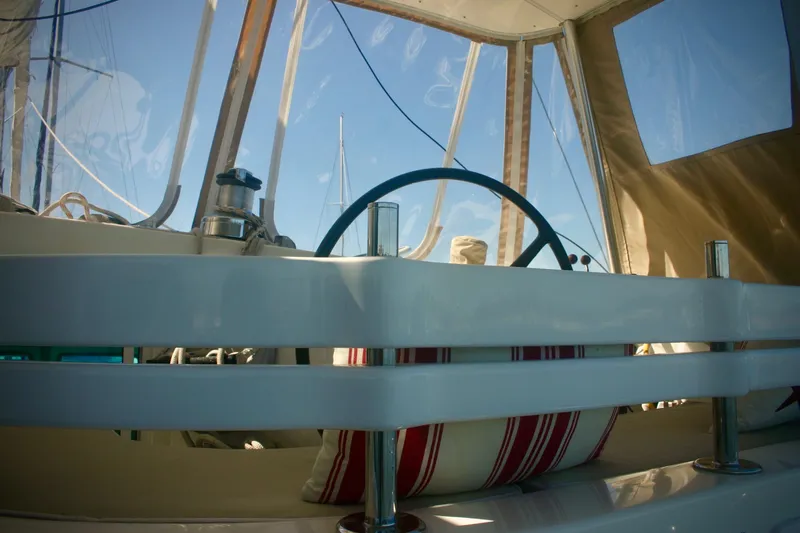 Slide: The Image of Interior view of a 2009 Prout 45S yacht cockpit with steering wheel and striped cushion. - 4