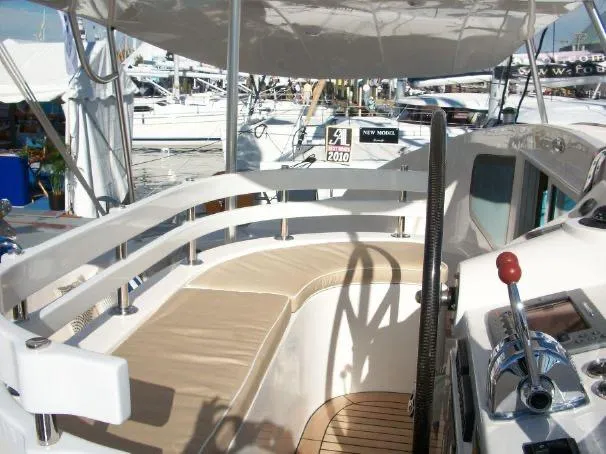 Slide: The Image of Cockpit of 2009 Prout 45S yacht with beige seating and control panel. - 40