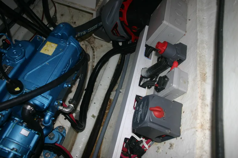 Slide: The Image of Engine compartment of 2009 Prout 45S with electrical components and wiring. - 47