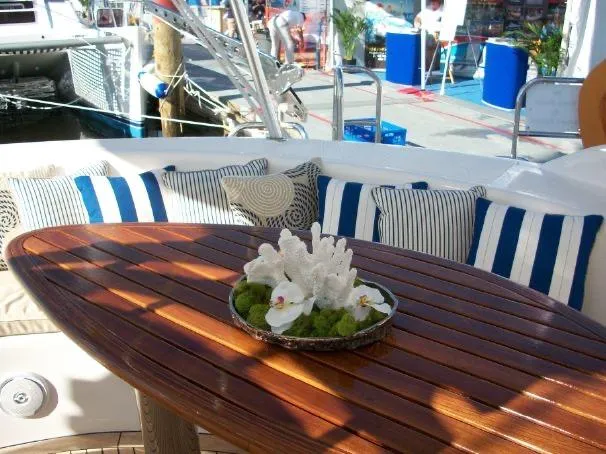 Slide: The Image of Luxurious Prout 45S yacht deck with striped cushions and elegant floral centerpiece, 2009 model. - 7