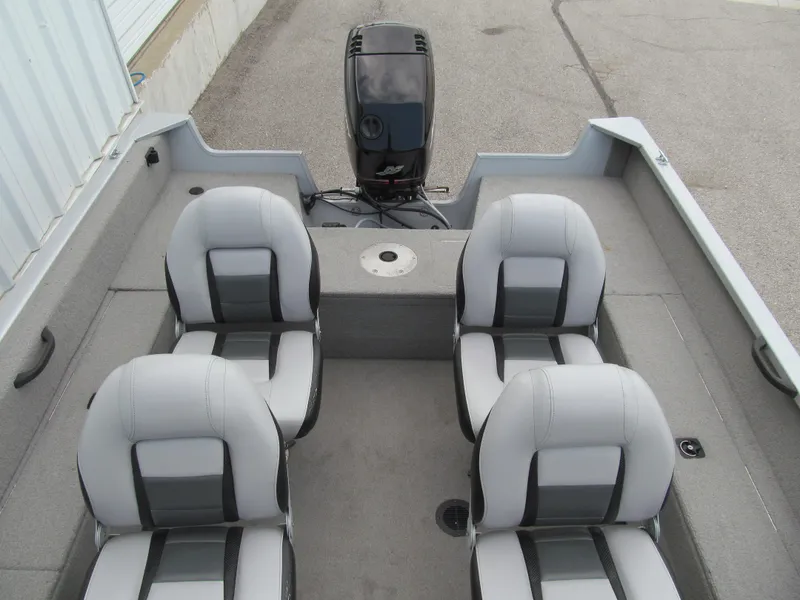 Slide: The Image of 2007 Tracker Pro Guide V-17 WT boat interior with four seats and motor. - 11