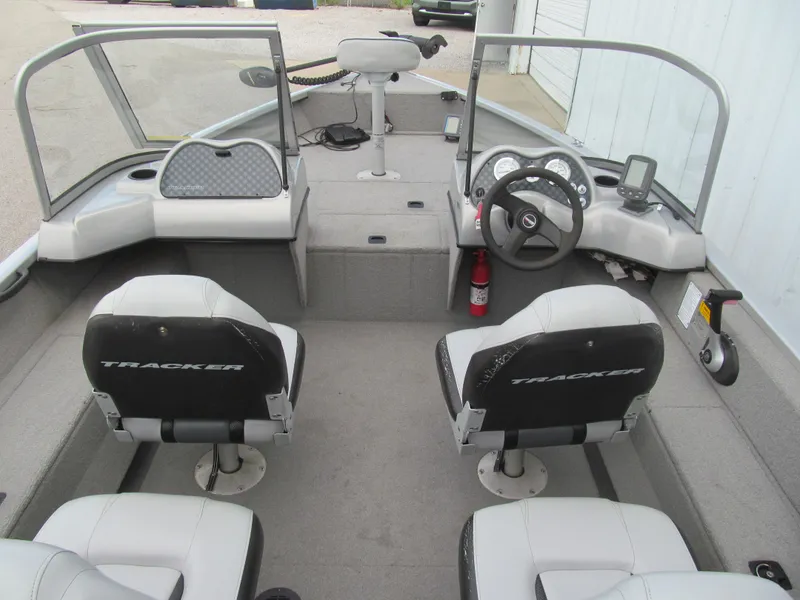 Slide: The Image of 2007 Tracker Pro Guide V-17 WT boat interior with seating and steering console. - 5