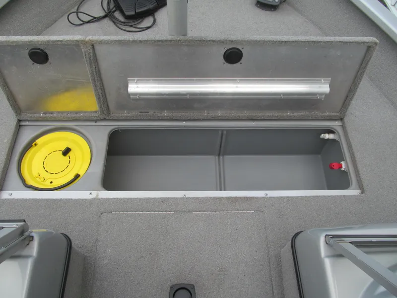 Slide: The Image of 2007 Tracker Pro Guide V-17 WT boat storage compartment with open lid and yellow hatch. - 9