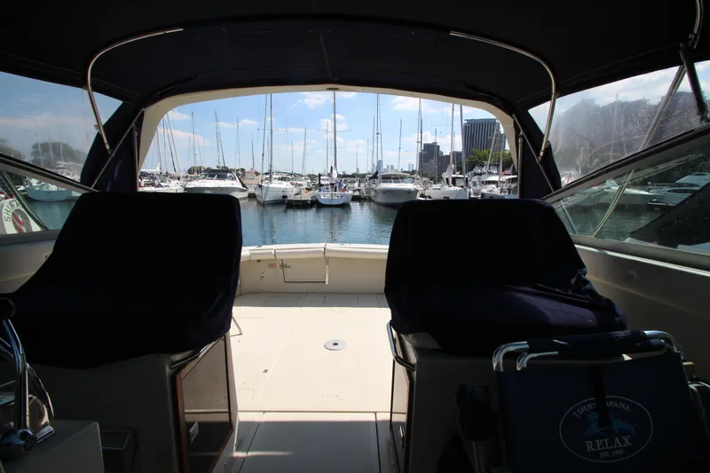 Slide: The Image of Interior view of a 1990 Boston Whaler 31 Sportfisherman overlooking a marina. - 31
