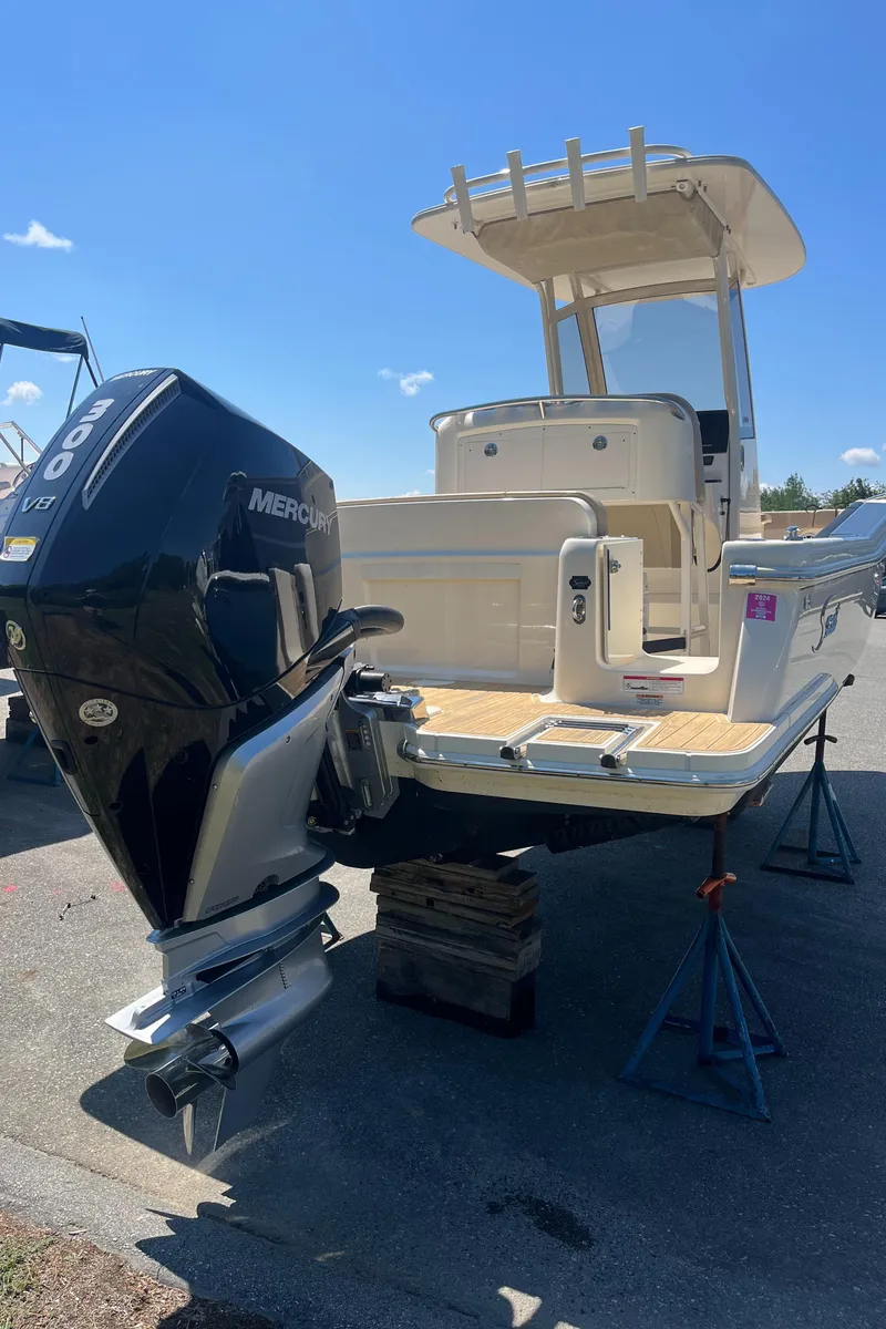 Slide: The Image of 2024 Scout 240 XSF boat with Mercury V8 engine on display. - 4