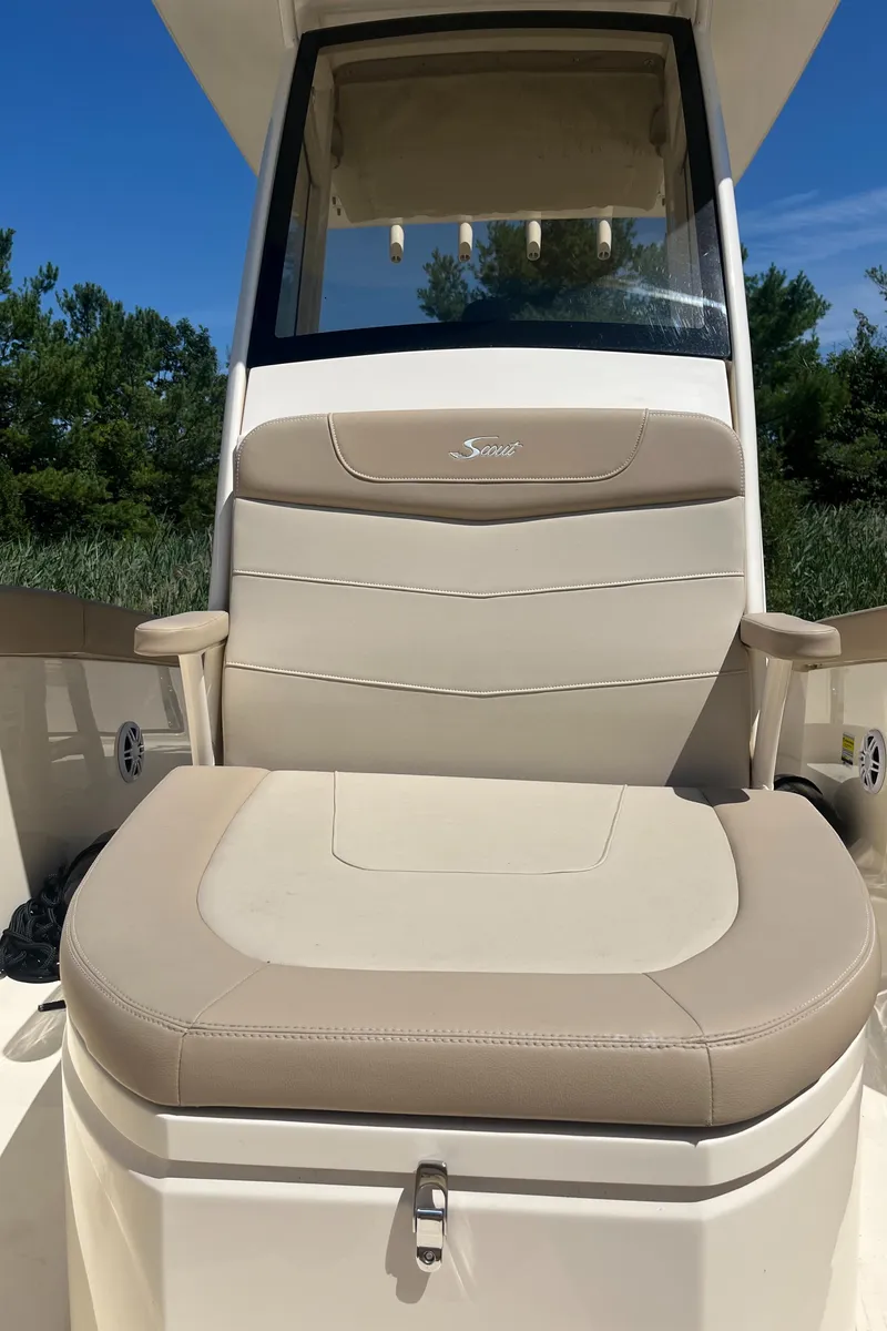 Slide: The Image of 2024 Scout 240 XSF boat seat with beige upholstery and armrests. - 9