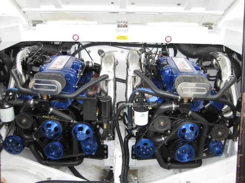 Slide: The Image of Twin engines of a 2000 Baja 40 Outlaw boat, showcasing powerful performance components. - 15