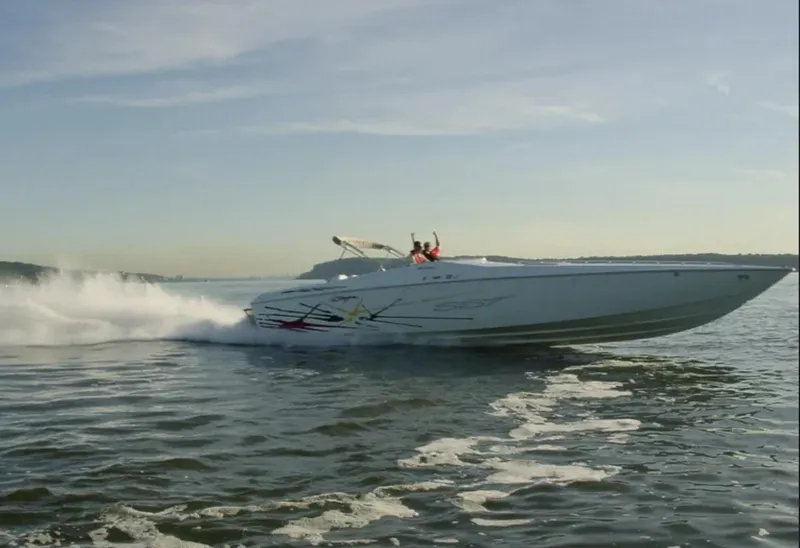 Slide: The Image of 2000 Baja 40 Outlaw speedboat cruising on open water at high speed. - 3