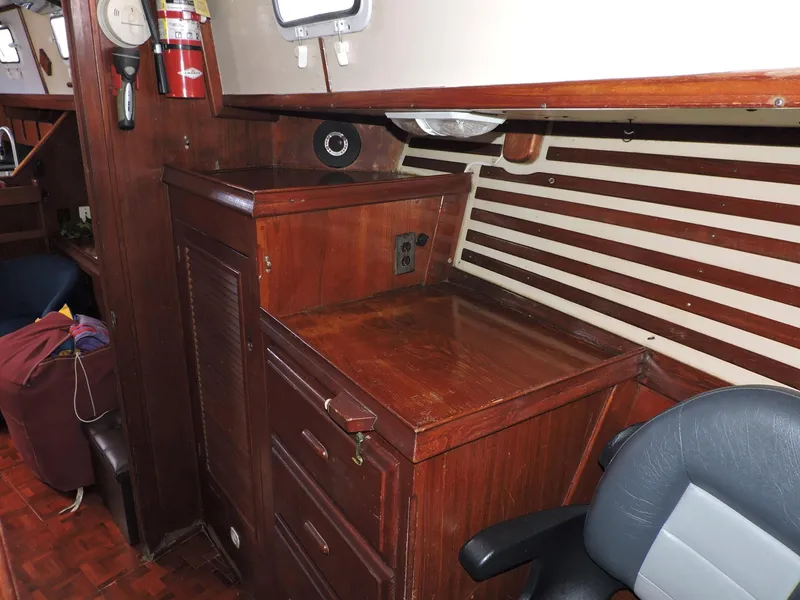 Slide: The Image of Interior of 1981 Endeavour 43 sailboat with wooden cabinetry and seating. - 20