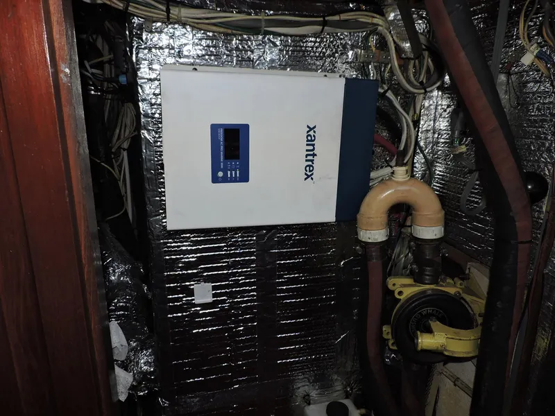 Slide: The Image of Electrical system inside 1981 Endeavour 43 boat, featuring Xantrex inverter and wiring. - 25