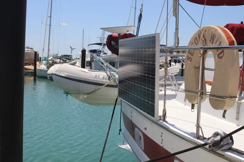 Slide: The Image of Sailboat Endeavour 43 (1981) with solar panel docked in marina. - 31