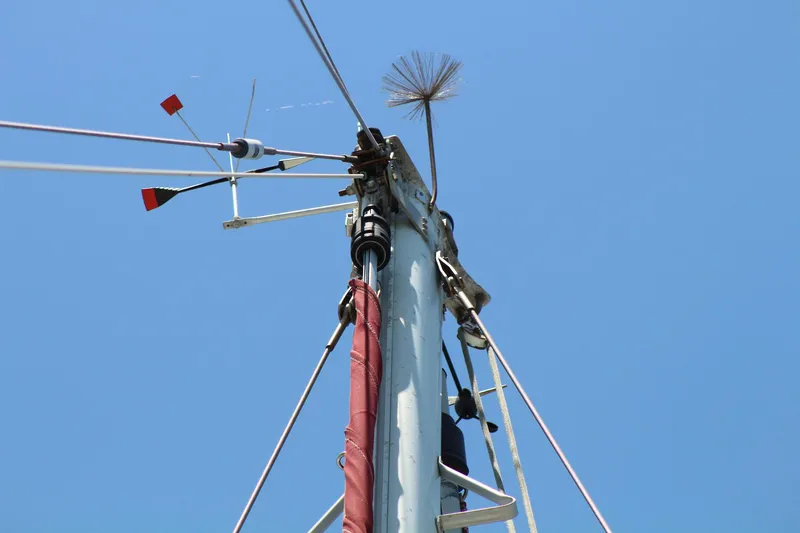 Slide: The Image of Mast of 1981 Endeavour 43 sailboat against clear blue sky. - 32