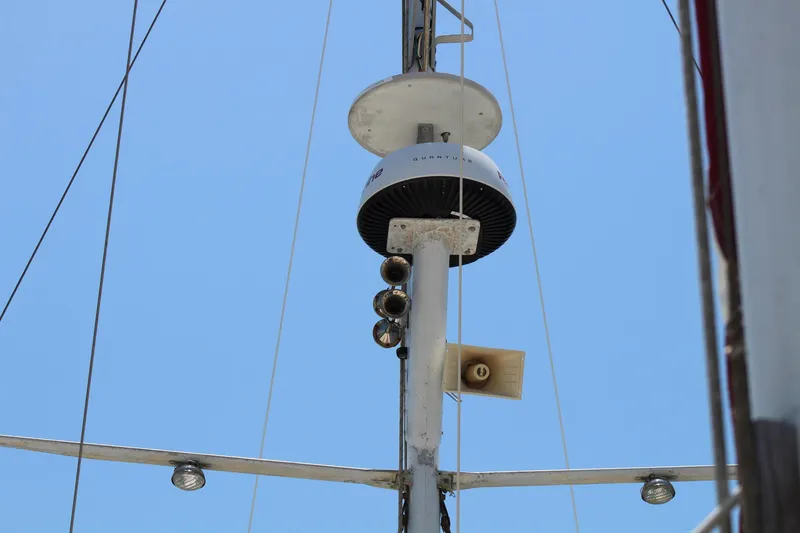 Slide: The Image of Mast equipment on 1981 Endeavour 43 sailboat against clear blue sky. - 33