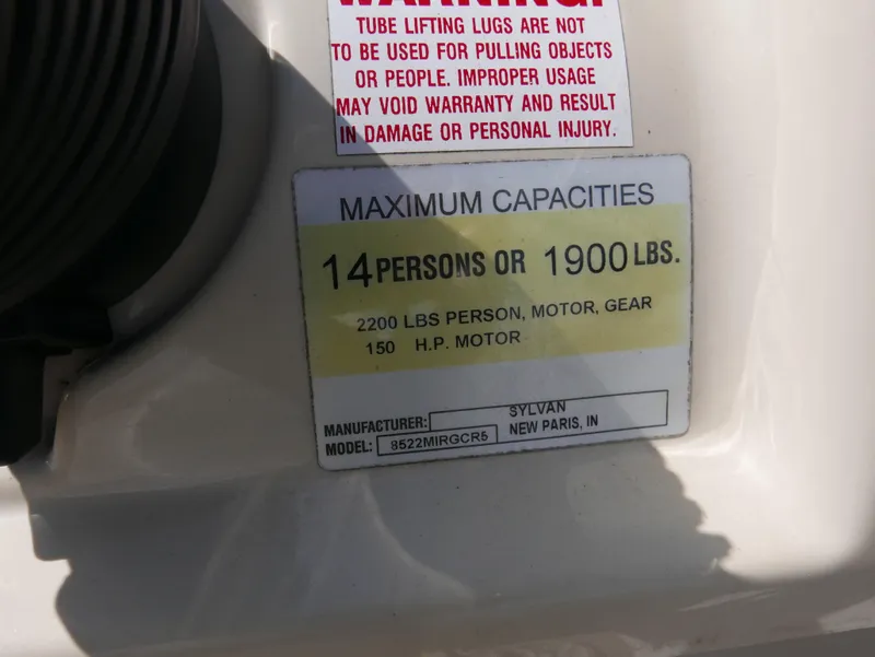 Slide: The Image of 2004 Sylvan Mirage 8522 capacity label: 14 persons or 1900 lbs, 150 HP motor. - 13