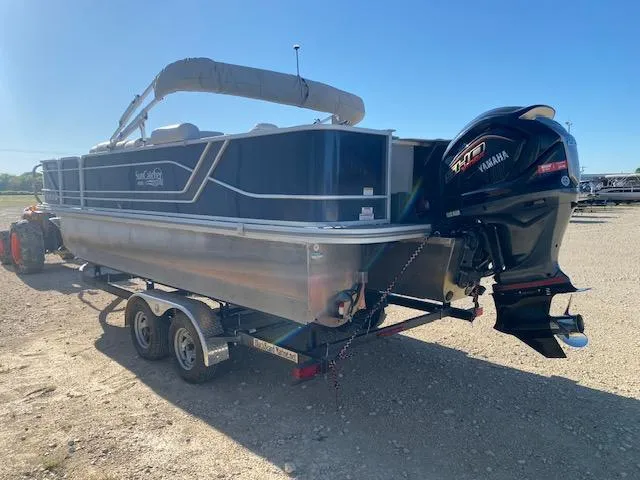 Slide: The Image of 2024 SunCatcher Fusion 322FC pontoon boat on trailer with Yamaha outboard motor. - 3