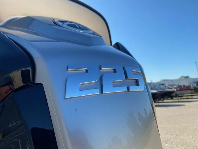 Slide: The Image of Close-up of a 225 horsepower engine on a 2024 SunCatcher Fusion 322FC boat. - 4