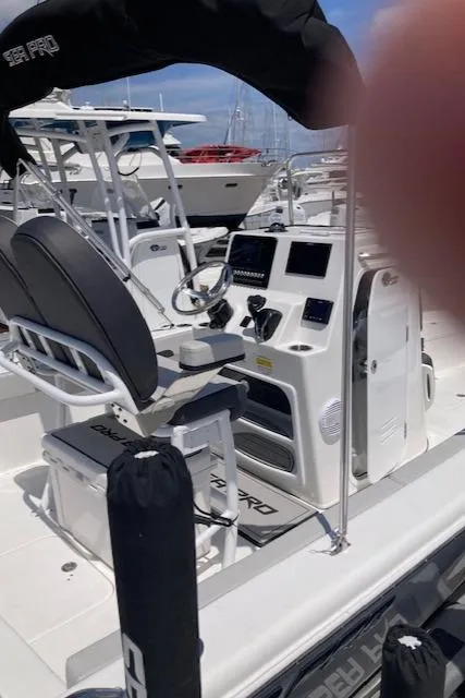 Slide: The Image of 2025 Sea Pro 202 Center Console boat with modern dashboard and seating. - 4