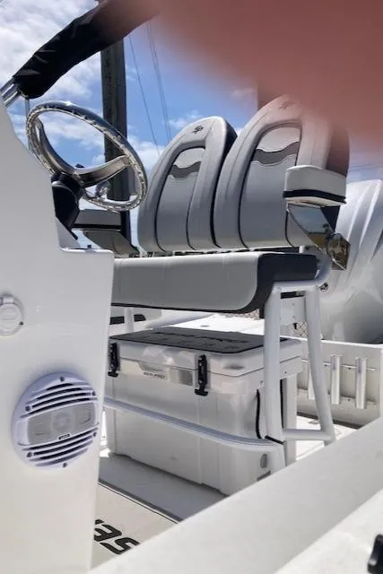Slide: The Image of 2025 Sea Pro 202 Center Console boat interior with dual seats and steering wheel. - 6
