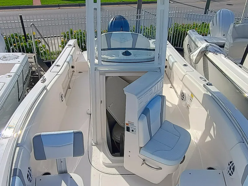 Slide: The Image of 2025 Robalo R230 Center Console boat interior with seating and helm station. - 10