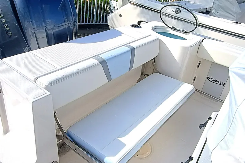 Slide: The Image of 2025 Robalo R230 Center Console boat interior with seating and storage. - 18