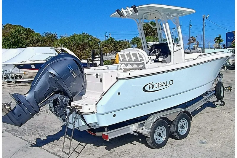 Slide: The Image of 2025 Robalo R230 Center Console boat on trailer, featuring Yamaha outboard motor. - 3